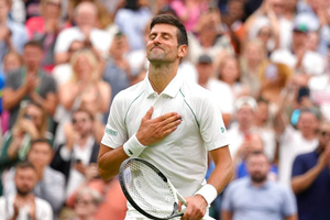 Novak Djokovic advances to the second round of Wimbledon.
