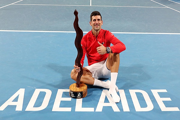 Djokovic defeats Korda in Adelaide after saving a championship point.