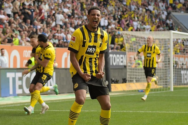 Borussia Dortmund a win away from the Bundesliga title after 3-0 victory over Augsburg.